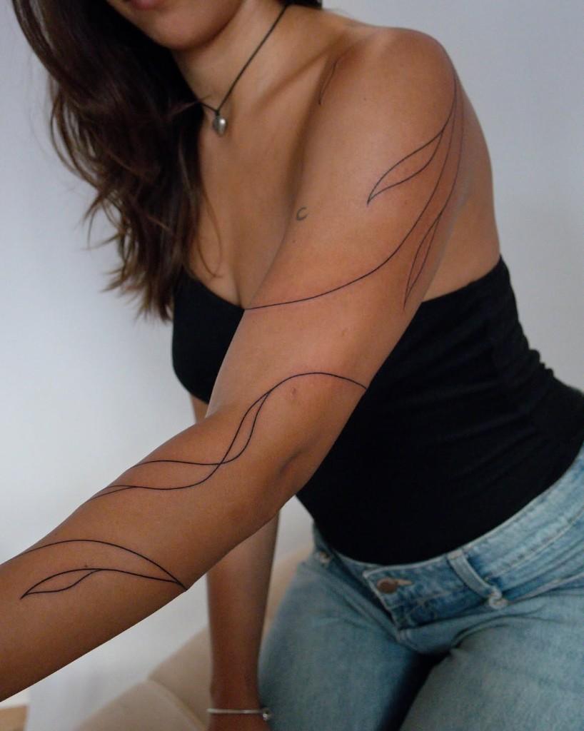Fine-line arm tattoo by giosuhettattoo